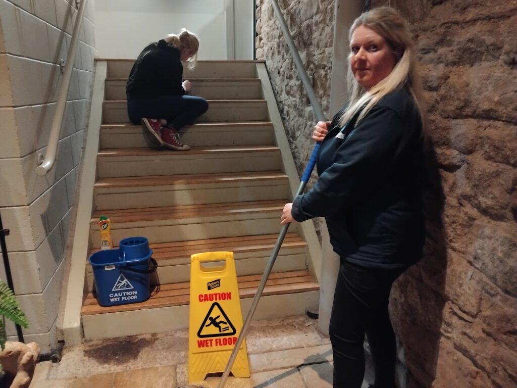 Clean Team deep clean Jan 2026 (2) Picture of two people cleaning the stairs in The Rum Story
